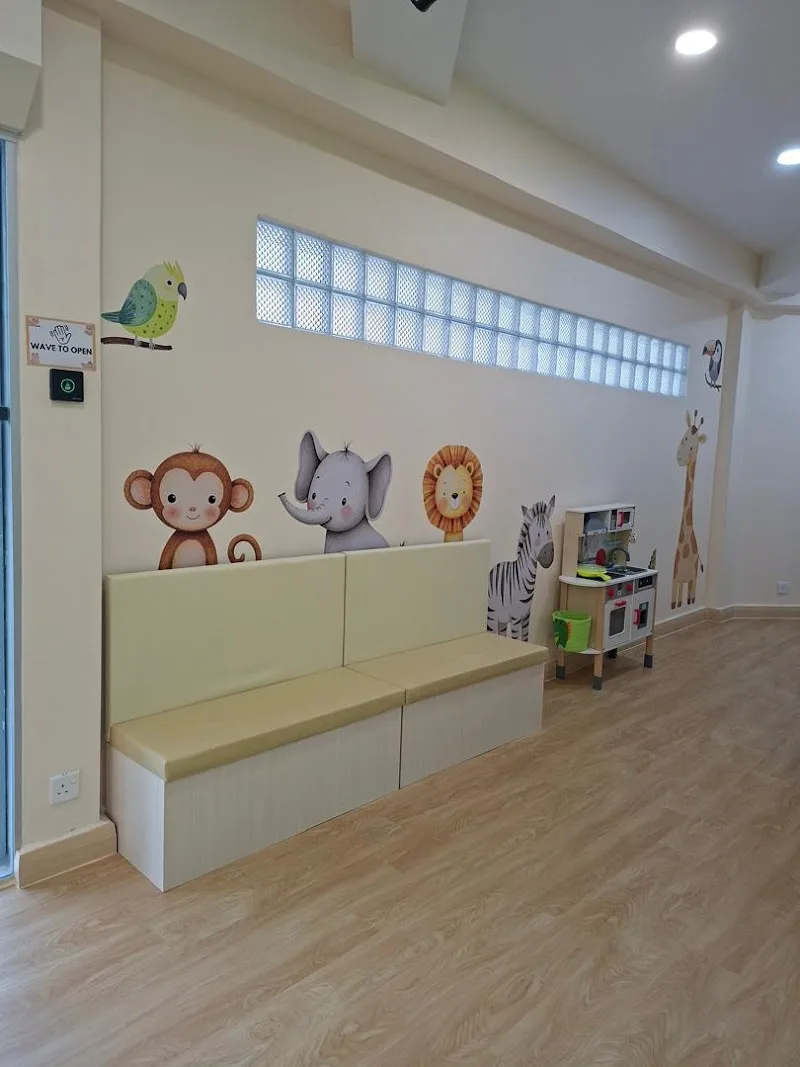 Children’s waiting area with animal wall art at Little Eden Child Specialist Clinic