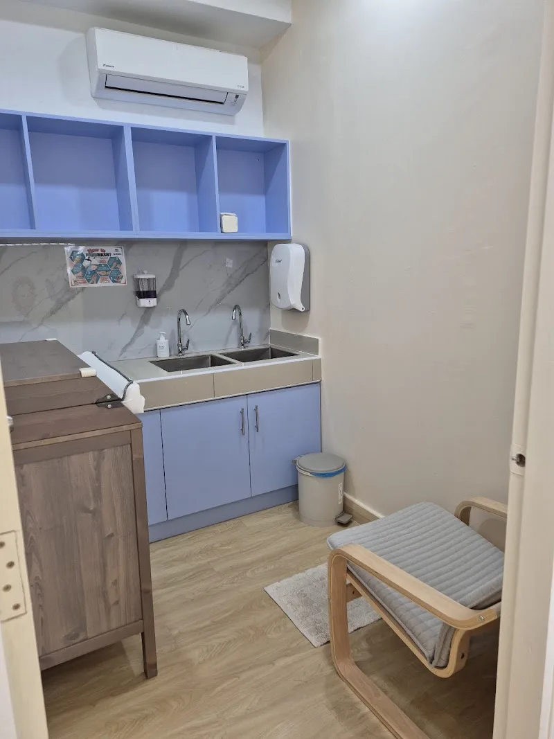 Baby changing and examination area with wash basin